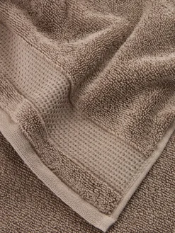 NORAGoldServiette de toilette NORA 50x100 sable foncé